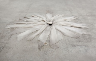 Marisa Merz, Untitled, 1979. Nylon lint, iron and stone, 15 x 290 x 290 cm. Courtesy of the artist and Barbara Gladstone Gallery, New York and Brussels Image ©