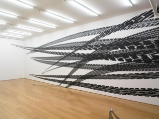 Regina Silveira, "Octopus (Track Series)" from the series "Derrapagem" (2009), vinyl and wooden models, installation view, 2009. Courtesy of Alexander Gray Associates, New York.