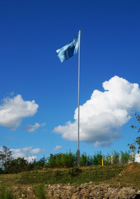 Byron Kim, Sky Blue Flag, 2018. Indigo dyed ramie, flag pole. Entrance of Soi Mountain, Cheorwon, Gangwondo. Commissioned by the Real DMZ Project.